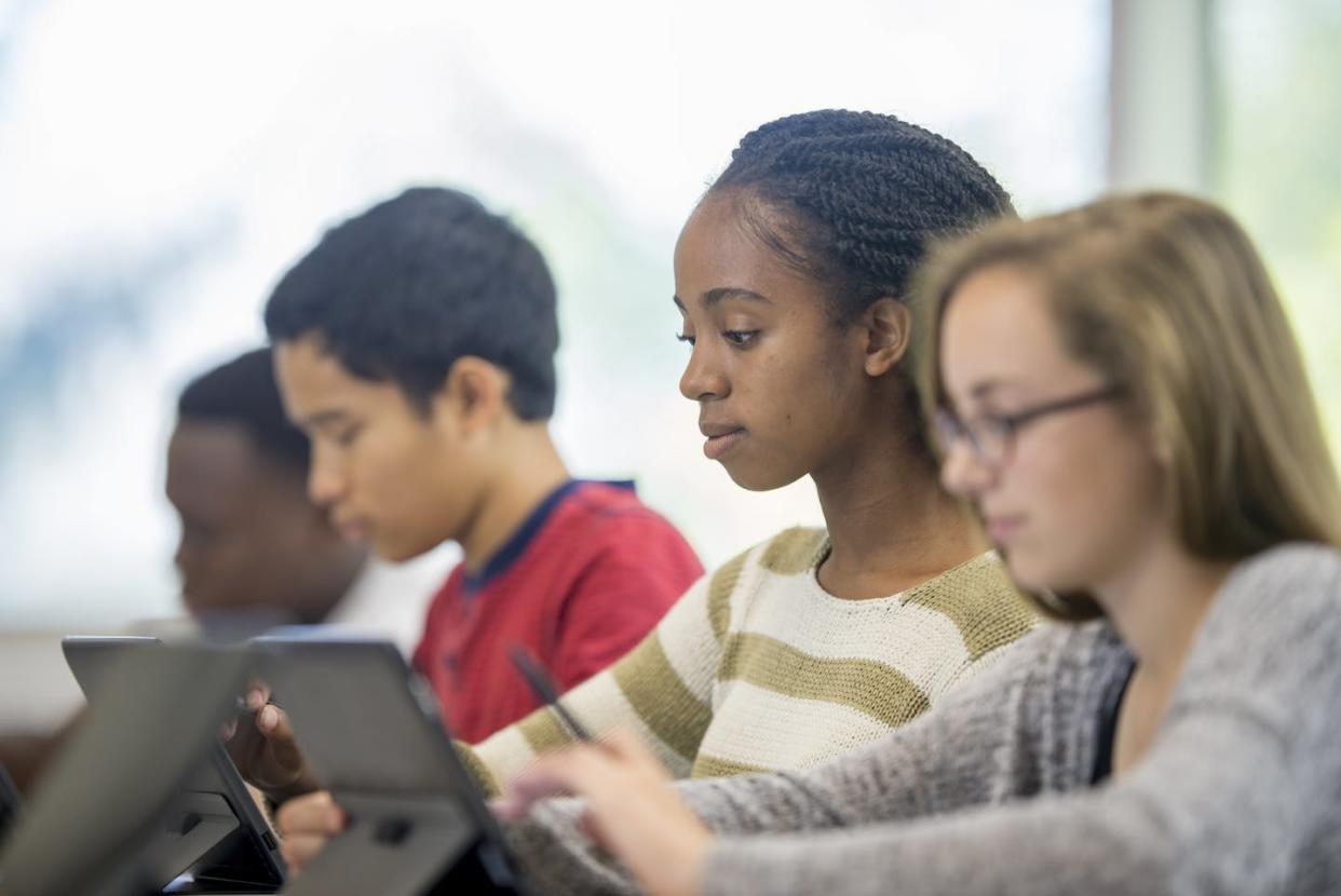 Certain state laws are banning the instruction of critical race theory. <a href="https://www.gettyimages.com/detail/photo/students-typing-on-their-personal-tablets-royalty-free-image/494616066?phrase=high+school+classroom&adppopup=true" rel="nofollow noopener" target="_blank" data-ylk="slk:FatCamera/E+ via Getty Images;elm:context_link;itc:0;sec:content-canvas" class="link ">FatCamera/E+ via Getty Images </a>