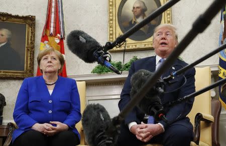 U.S. President Donald Trump meets with German Chancellor Angela Merkel in the White House Oval Office in Washington, U.S., April 27, 2018. REUTERS/Kevin Lamarque