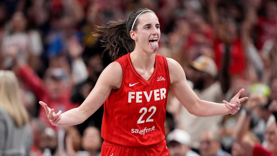 Caitlin Clark of the Indiana Fever celebrates a basket during the second half of a game against the Las Vegas Aces. - Emilee Chinn/Getty Images