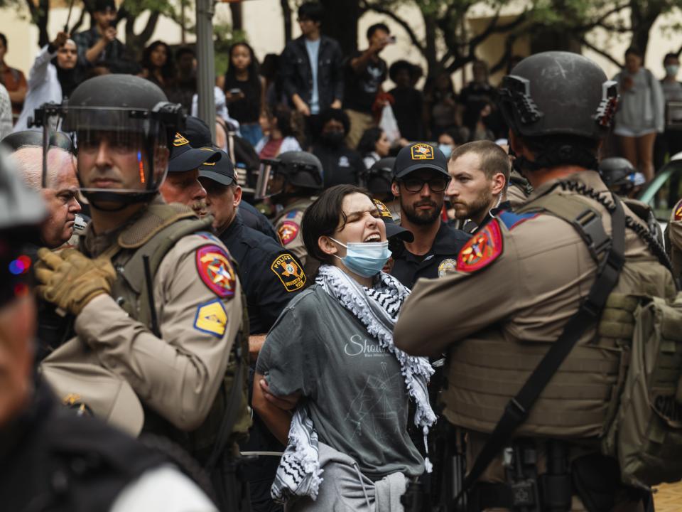 Texas law enforcement detain a protester on April 24, 2024.