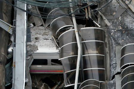 A train car is pictured in an aerial photo inside the New Jersey Transit Hoboken Terminal following a train crash in Hoboken, New Jersey, U.S. on September 29, 2016. REUTERS/Carlo Allegri/File Photo