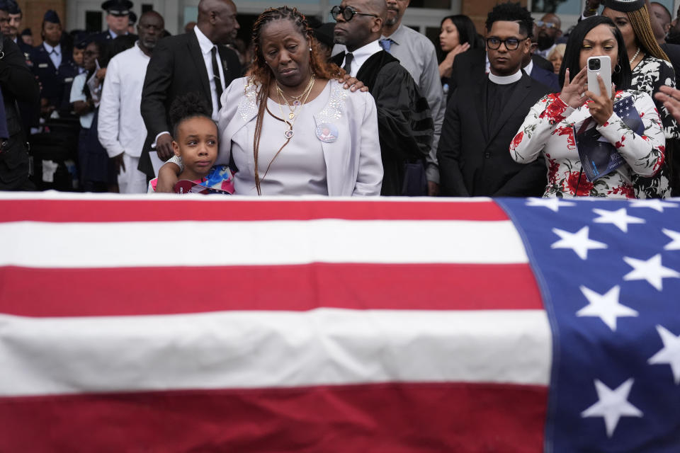 FILE - Chantemekki Fortson the mother of slain airman Roger Fortson, right, along with family watch Fortson's casket as they leave for a cemetery during his funeral at New Birth Missionary Baptist Church, Friday, May 17, 2024, in Stonecrest, Ga. (AP Photo/Brynn Anderson, File)