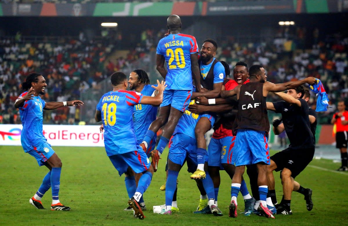 Celebrations: DR Congo came from a goal behind to brush aside Guinea on Friday (REUTERS)