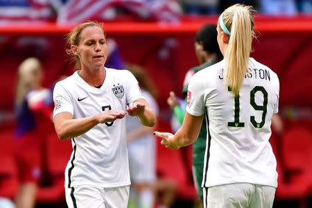 Jun 16, 2015; Vancouver, British Columbia, CAN; United States defender Christie Rampone (3) and defender Julie Johnston (19) high five after their win over Nigeria in a Group D soccer match in the 2015 FIFA women's World Cup at BC Place Stadium. The United States won 1-0 and win Group B. Mandatory Credit: Anne-Marie Sorvin-USA TODAY Sports