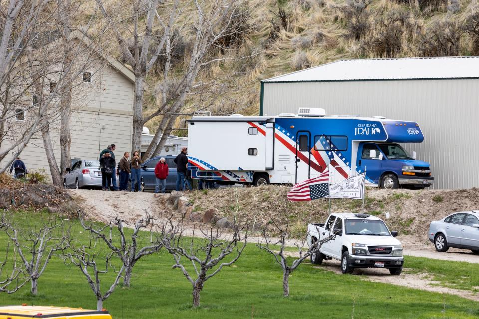 Supporters gather on the property of former Idaho gubernatorial candidate and far-right activist Ammon Bundy after law enforcement officers attempted to arrest Bundy on a misdemeanor warrant for contempt of court earlier in the day, on April 24, 2023, in Emmett, Idaho. A jury on Monday, July 24, 2023, awarded an Idaho hospital more than $50 million in damages in a defamation case the institution brought against far-right activist Ammon Bundy and others. (AP Photo/Kyle Green, File)