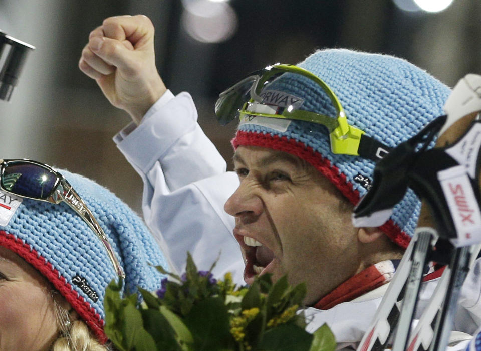 Norway's Ole Einar Bjoerndalen celebrates winning the gold after the mixed biathlon relay, at the 2014 Winter Olympics, Wednesday, Feb. 19, 2014, in Krasnaya Polyana, Russia. (AP Photo/Matthias Schrader)