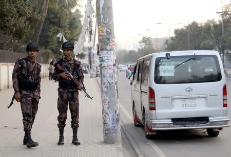 Members of the Border Guard Bangladesh (BGB) are seen on duty in front of Bangladesh Government Printing Press ahead of the 11th general election in Dhaka, Bangladesh, December 28, 2018. REUTERS/Mohammad Ponir Hossain