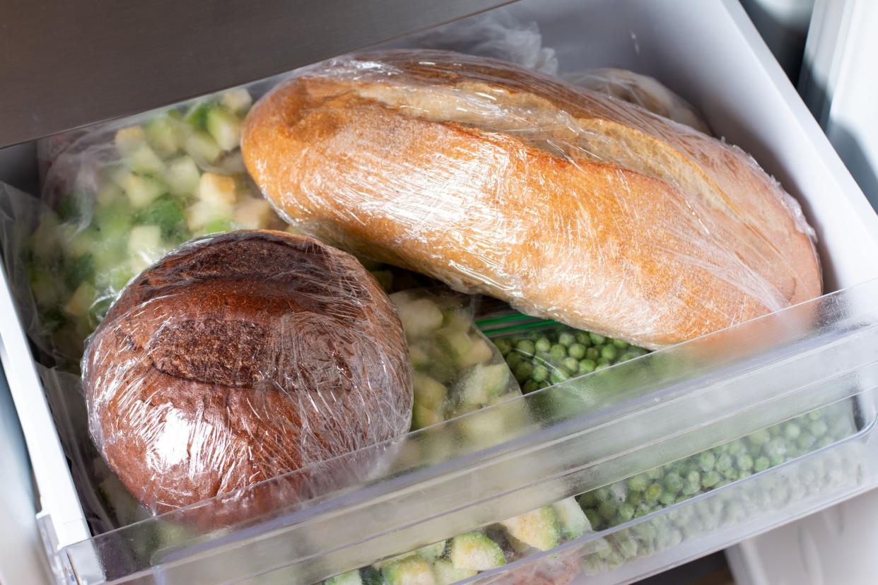 Frozen bread in the home freezer. The frozen products. Long life food storage concept.