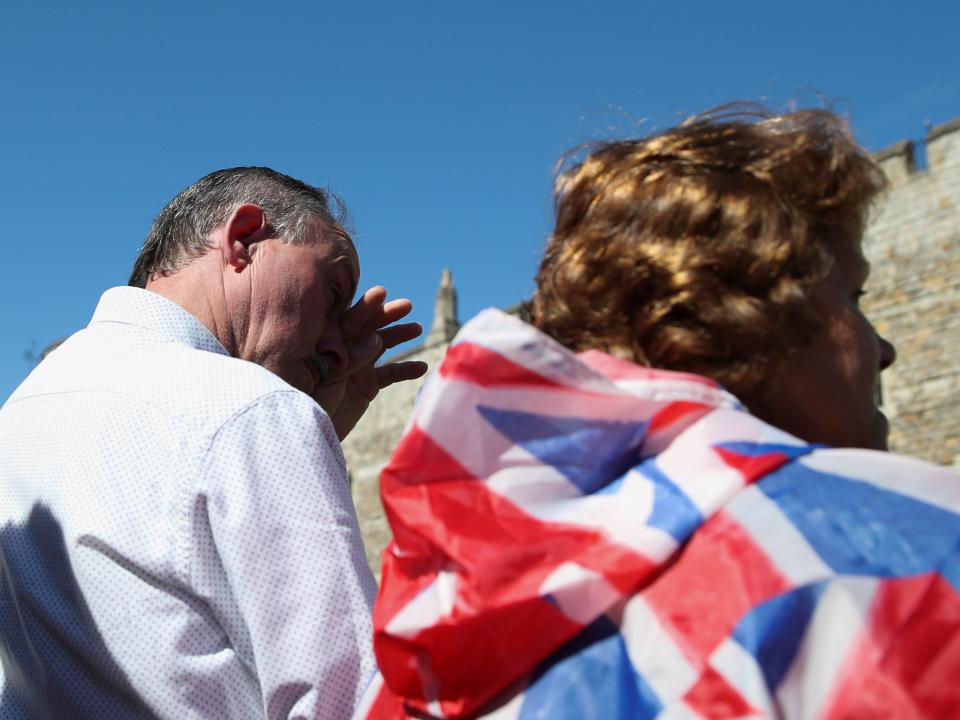 A man wipes his tears during a minute's silence for the funeral of Britain's Prince PhilipREUTERS