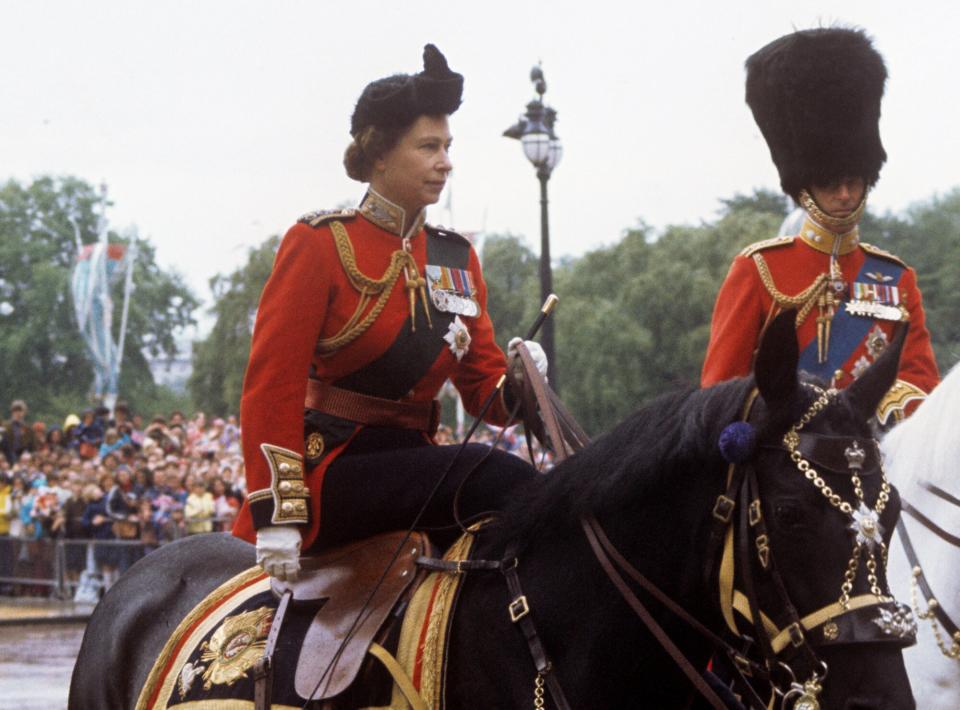 Queen Elizabeth II, in the uniform of Colonel-in-Chief of the Scots Guards, and the Duke of Edinburgh, Colonel of the Grenadier Guards, during the Trooping the Colour ceremony]