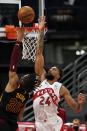 Toronto Raptors center Khem Birch (24) blocks a shot by Cleveland Cavaliers' Isaac Okoro (35) during the second half of an NBA basketball game Monday, April 26, 2021, in Tampa, Fla. (AP Photo/Chris O'Meara)