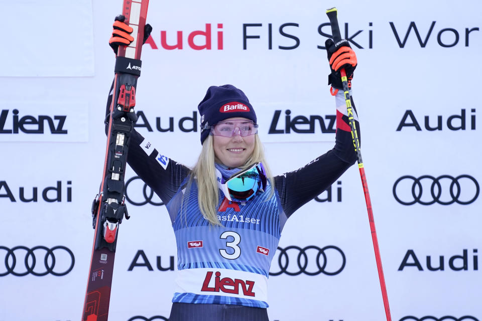 United States' Mikaela Shiffrin celebrates on the podium after winning an alpine ski, women's World Cup giant slalom race, in Lienz, Austria, Thursday, Dec. 28, 2023. (AP Photo/Giovanni Auletta)