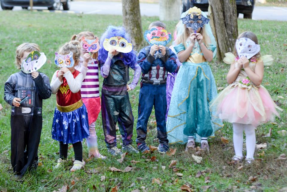 Participants show off their masks during the 2020 Not So Spooky Animals learning program held at Bledsoe Creek State Park in Gallatin.