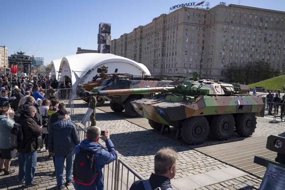 Visitors look at a French-made AMX-10RC armored vehicle at an exhibition of Western military equipment captured from Kyiv forces during the fighting in Ukraine, in Moscow on Friday, May 3, 2024. The exhibit organized by the Russian Defense Ministry features more than 30 pieces of Western-made heavy equipment, including a U.S.-made M1 Abrams tank and a Bradley armored fighting vehicle. (AP Photo/Alexander Zemlianichenko)