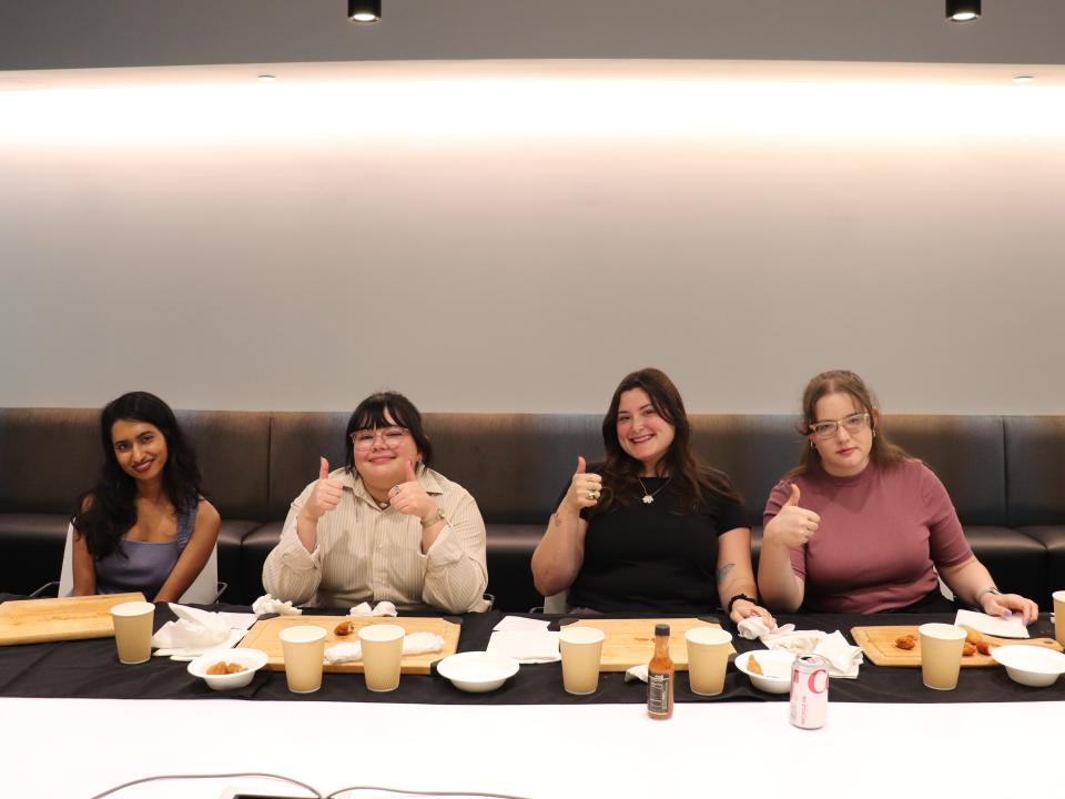 Four of Insider's reporters after completing the "Hot Ones" challenge.