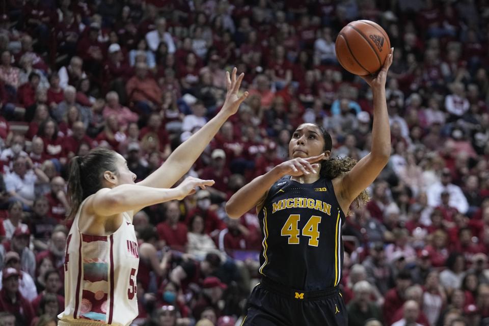 Michigan's Cameron Williams (44) shoots over Indiana's Mackenzie Holmes (54) during the first half of an NCAA college basketball game Thursday, Feb. 16, 2023, in Bloomington, Ind. (AP Photo/Darron Cummings)