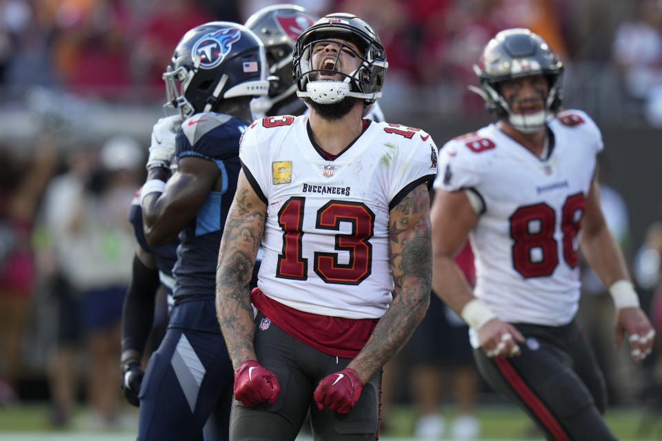 Tampa Bay Buccaneers wide receiver Mike Evans (13) celebrates a touchdown against the Tennessee Titans during the second half of an NFL football game Sunday, Nov. 12, 2023, in Tampa, Fla. (AP Photo/Chris O'Meara)
