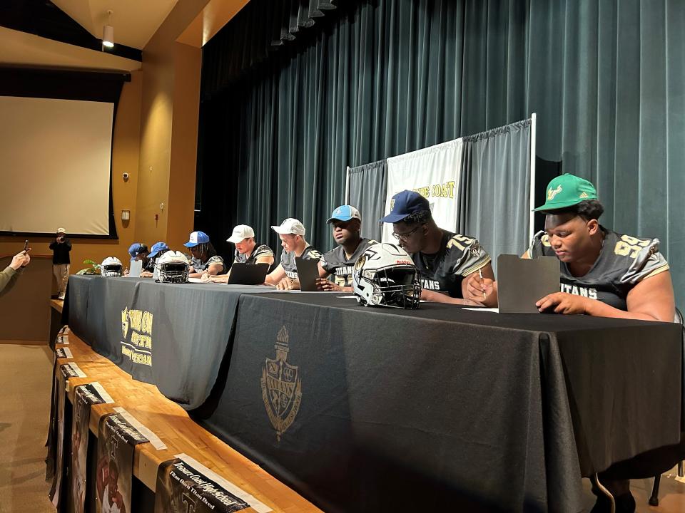 Treasure Coast High School football players sign their college letters of intent during National Signing Day on Wednesday, Feb. 7, 2024 from the Treasure Coast High School auditorium.