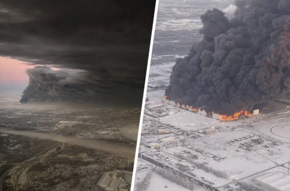 A huge billow of black smoke emerging from a fire, as seen from the air