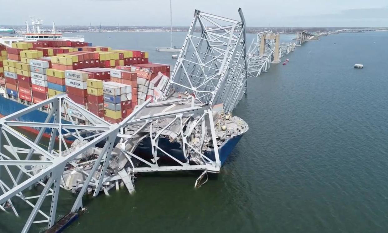 <span>A drone view of the Dali cargo vessel, which crashed into the Francis Scott Key Bridge causing it to collapse, and cutting off access to the Port of Baltimore.</span><span>Photograph: NTSB/Reuters</span>