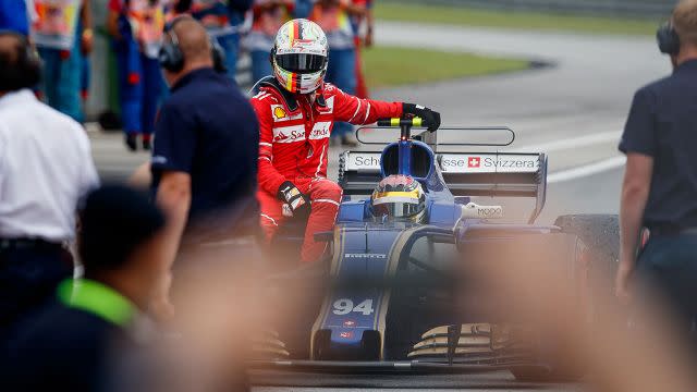 Vettel had to hitch a ride back to the pits. Image: Getty