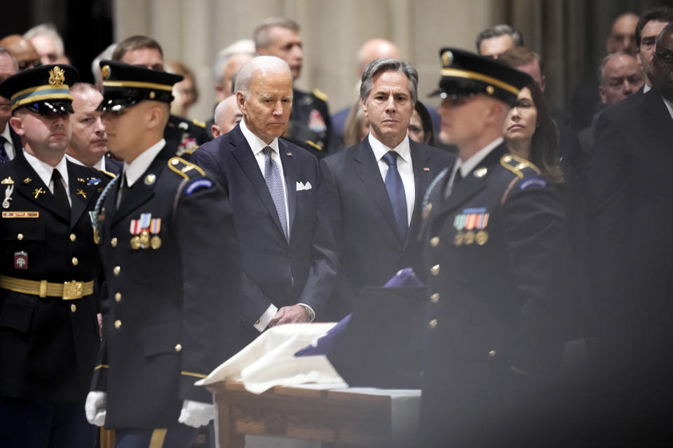 President Joe Biden and Secretary of State Antony Blinken look towards the urn with the cremated remains offormer Defense Secretary Ash Carter during a memorial service for Carter at the National Cathedral, Thursday, Jan. 12, 2023, in Washington. (AP Photo/Andrew Harnik)