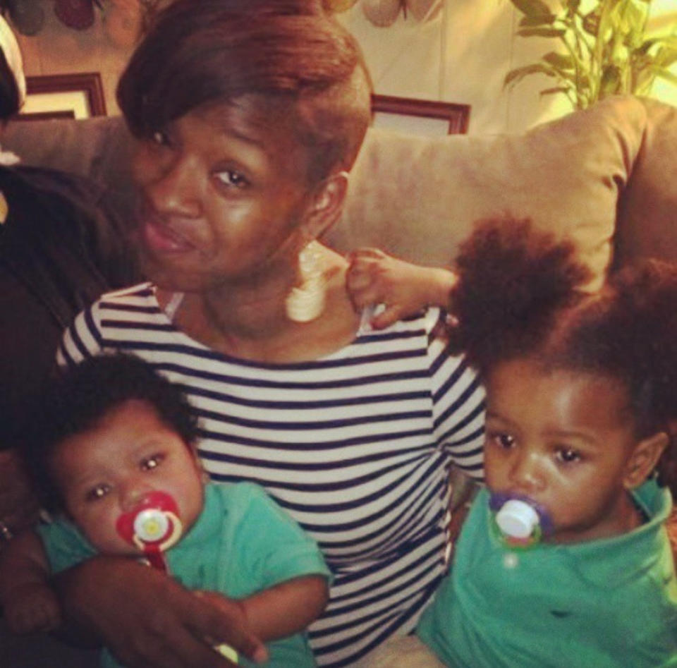 This photo provided by Latanya Byrd, shows Samara Banks holding her sons, Saa'mir Williams, left, and Saa'sean Williams. Banks, along with three of her four children, Saa'deem Griffin, not pictured, Saa'mir Williams, and Saa'sean Williams were struck by a car and killed in 2013 while crossing Roosevelt Boulevard in Philadelphia. A fourth son, Saa'yon Griffin survived the crash. (Latanya Byrd via AP)