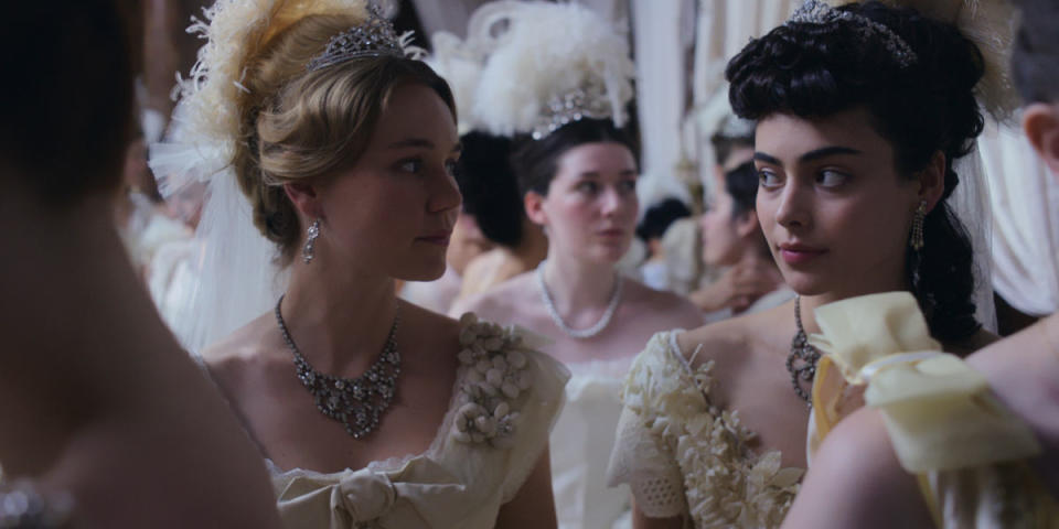 "Each girl had to feel like she was coming from a whole different family," says costume designer Giovanni Lipari. Jinny (Imogen Waterhouse) and Lizzy (<em>Aubri Ibrag</em>) hit the London debutante scene in all their finery.<p>Photo: Courtesy of Apple TV+</p>