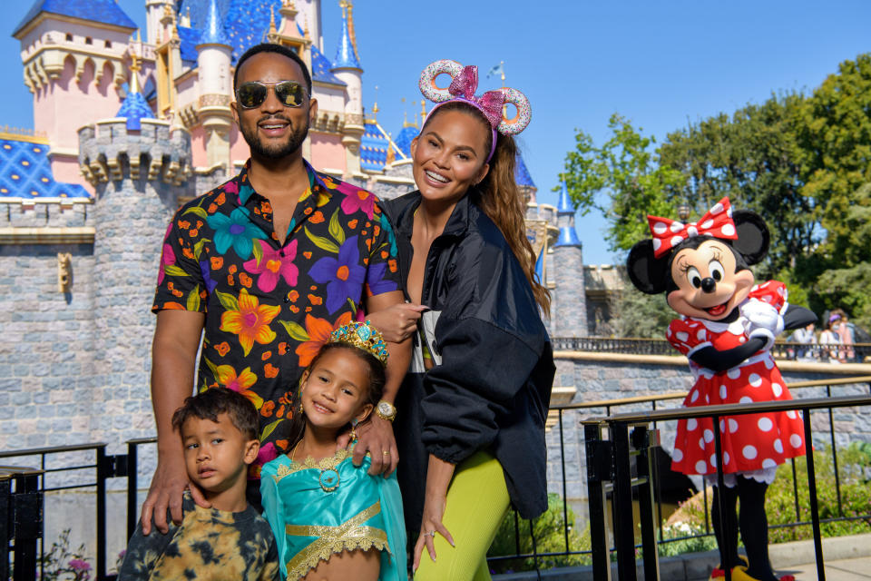 John Legend and Chrissy Teigen at Disneyland with Miles and Luna