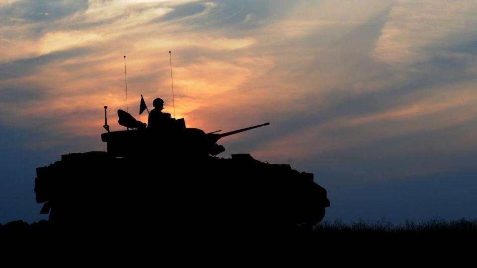 A National Guard-crewed Bradley from the 1st Combined Arms Battalion, 194th Armor Regiment, fires at Camp Ripley Training Center, Minnesota, on Aug. 5, 2014. The Guard helped reduce operational tempo strain on active tank units by taking over the Operation Spartan Shield rotation to the Middle East beginning in late 2019. (Staff Sgt. Bill Boecker/Army)