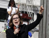 FILE - In this Oct. 17, 2018, file photo, Oregon Gov. Kate Brown speaks during a rally in Portland, Ore. The stark divide in Oregon between the state's liberal, urban population centers and its conservative and economically depressed rural areas makes it fertile ground for the political crisis unfolding over a push by Democrats to enact sweeping climate legislation. “This is not the Oregon Way and cannot be rewarded,” said Democratic Brown. “The Republicans are driving us away from the values that Oregonians hold dear, and are moving us dangerously close to the self-serving stalemate in Washington, D.C." (AP Photo/Don Ryan, File)
