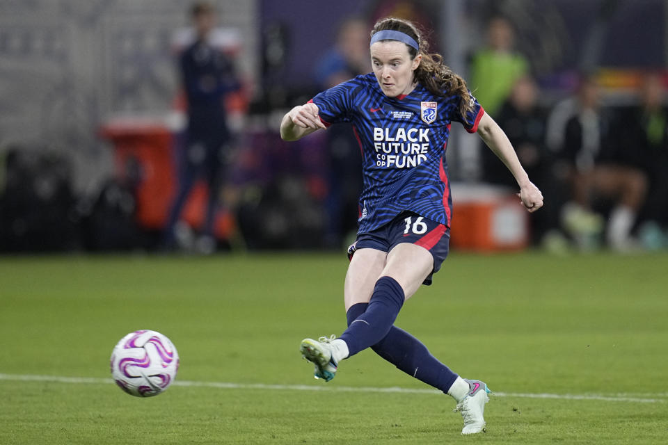 FILE -O L Reign midfielder Rose Lavelle scores a goal during the first half of the NWSL Championship soccer game against NJ/NY Gotham, Saturday, Nov. 11, 2023, in San Diego. National Women's Soccer League champion Gotham FC has signed U.S. national team players and World Cup champions Rose Lavelle and Emily Sonnett through 2026, the team announced Thursday, Jan. 4, 2024. Lavelle and Sonnett, both midfielders, played for OL Reign last season and were free agents.(AP Photo/Gregory Bull, File)