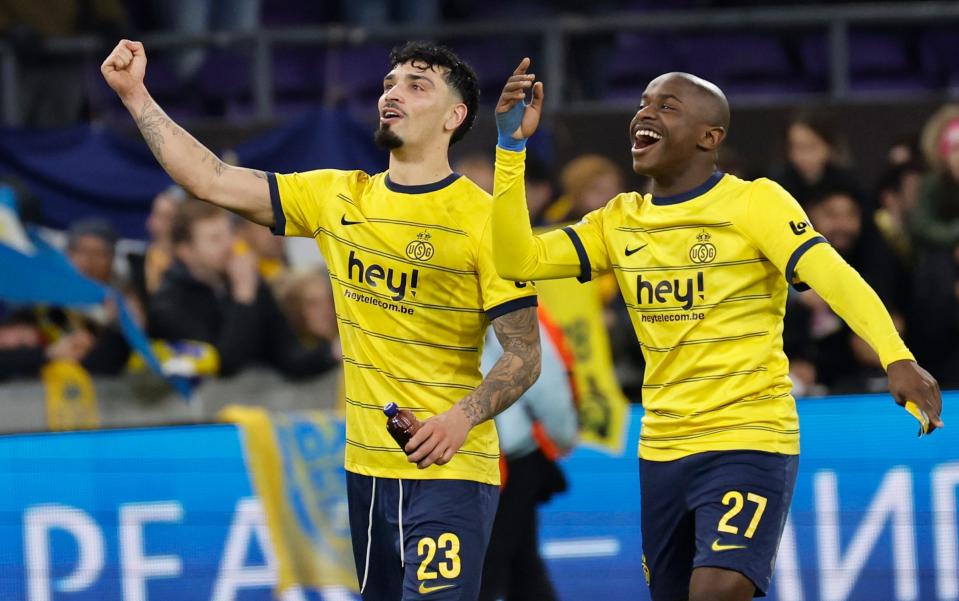 Union SG's Cameron Puertas and his teammate Noah Sadiki celebrate at the end of the Europa League Group E soccer match between Union SG and Liverpool at the RSC Anderlecht stadium in Brussels, Thursday, Dec. 14, 2023