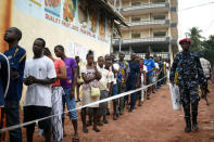 People queue to cast their vote during a presidential run-off in Freetown, Sierra Leone March 31, 2018. REUTERS/Olivia Acland