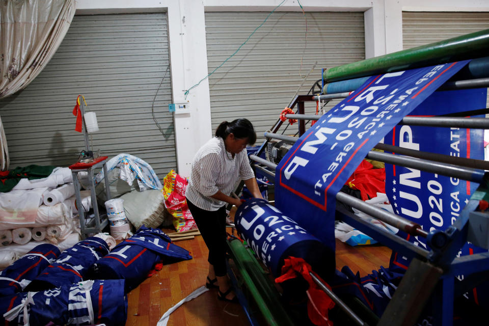 <p>A worker makes flags for U.S. President Donald Trump’s “Keep America Great!” 2020 re-election campaign at Jiahao flag factory in Fuyang, Anhui province, China July 24, 2018. (Photo: Aly Song/Reuters) </p>