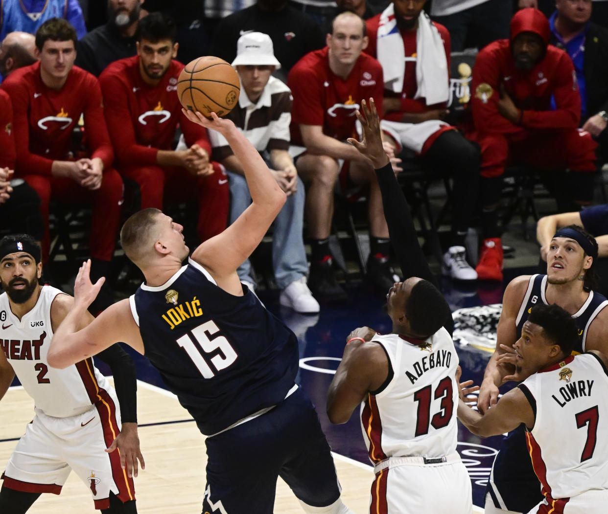 DENVER, CO - JUNE 04: Nikola Jokic (15) of the Denver Nuggets attempts a shot against Bam Adebayo (13) of the Miami Heat and Kyle Lowry (7) of the Miami Heat in the fourth quarter during Game 2 of the NBA Finals at Ball Arena June 04, 2023. (Photo by Andy Cross/MediaNews Group/The Denver Post via Getty Images)