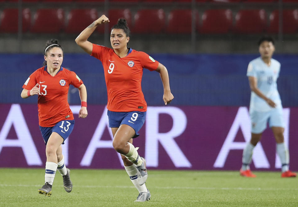 Chile's Maria Urrutia, center, celebrates after scoring her side's second goal during the Women's World Cup Group F soccer match between Thailand and Chile at the Roazhon Park in Rennes, France, Thursday, June 20, 2019. (AP Photo/David Vincent)