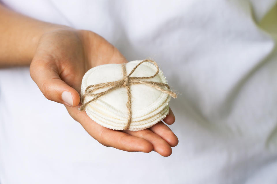 Cotton balls, pads and rounds are a huge part of skin care routines, but they create a lot of waste. Reusable cotton pads are a sustainable and environmentally-friendly alternative for cleansing and toning that can be washed and reused.  (Photo: Elena Feodrina via Getty Images)