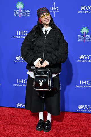 <p>Axelle/Bauer-Griffin/FilmMagic</p> Billie Eilish carries a Playboy backpack the 2024 Palm Springs International Film Festival