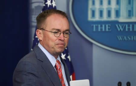 Acting White House Chief of Staff Mulvaney arrives to answer questions at media briefing at the White House in Washington