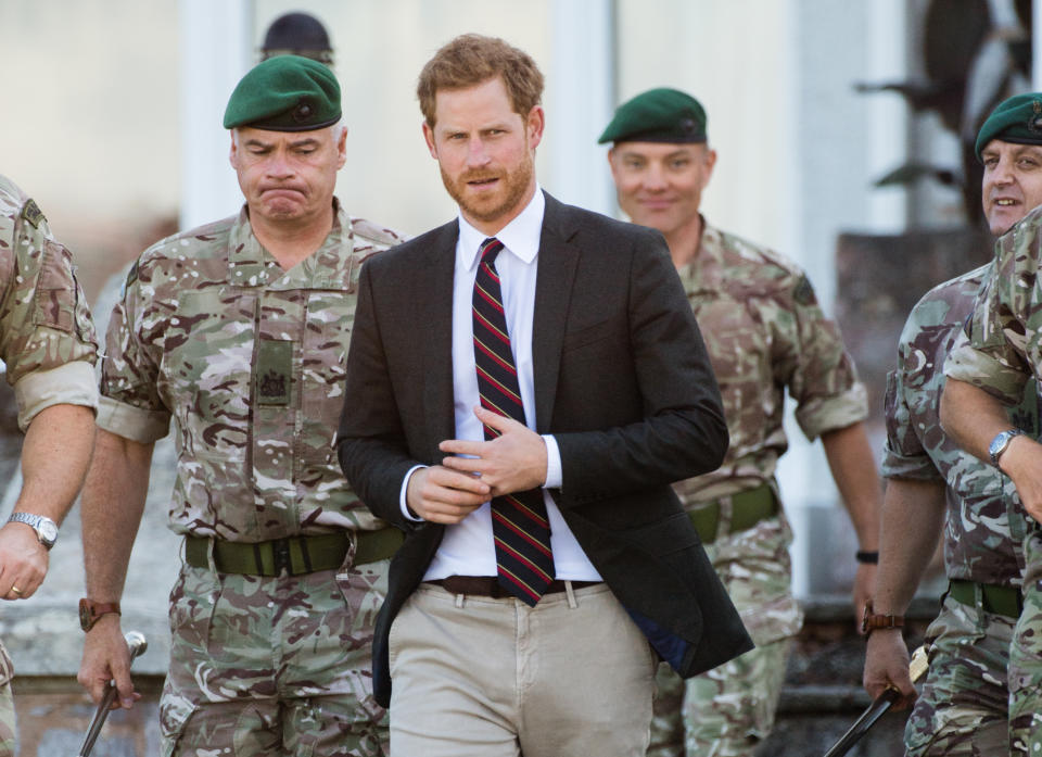 Prince Harry was seen touching his wedding band while inspecting the troops – but it doesn’t necessarily mean trouble. <em>(Photo via Getty Images)</em>
