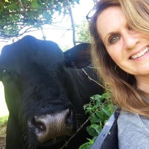 Buster, the cow, and the woman take a selfie