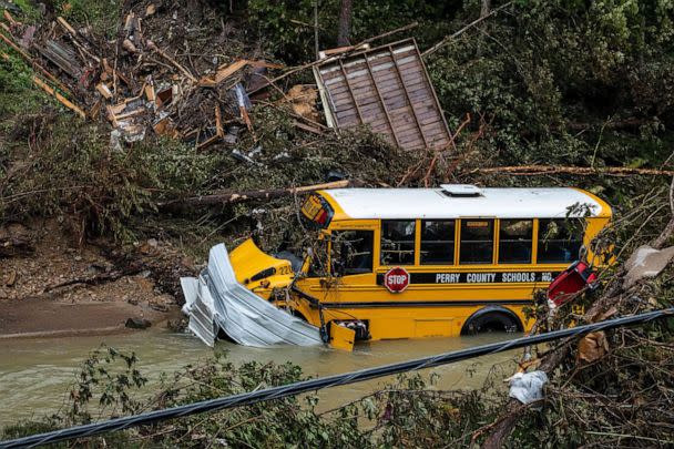 PHOTO: A Perry County school bus, along with other debris, sits in a creek near Jackson, Ky., July 31, 2022. (Seth Herald/AFP via Getty Images)