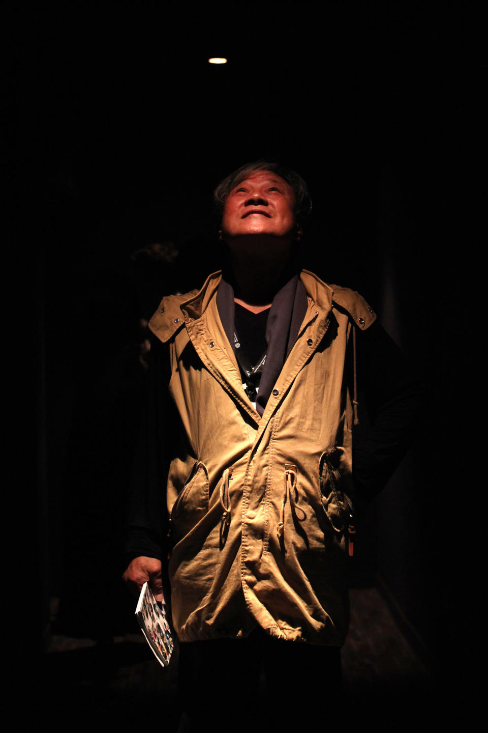 In this Friday, Oct. 4, 2013 photo, South Korean director Lee Jang-ho poses before the screening of his film "God's Eye View" at Megabox Haeundae Theater during Busan International Film Festival in Busan, South Korea. The new drama by Lee, well-known in South Korea for his commercial movies in the 1970s and the 1980s, borrows from true events to examine religious conviction in a country that sends out many of the world’s Christian missionaries. The film portrays Christian volunteers kidnapped by Muslim rebels while on an evangelical mission in a fictional Islamic country. The film directly references the 2007 crisis in which 23 members of Saemmul Presbyterian Church were taken as hostages by the Taliban in Afghanistan in 2007, and two of them were killed. (AP Photo/Woohae Cho)