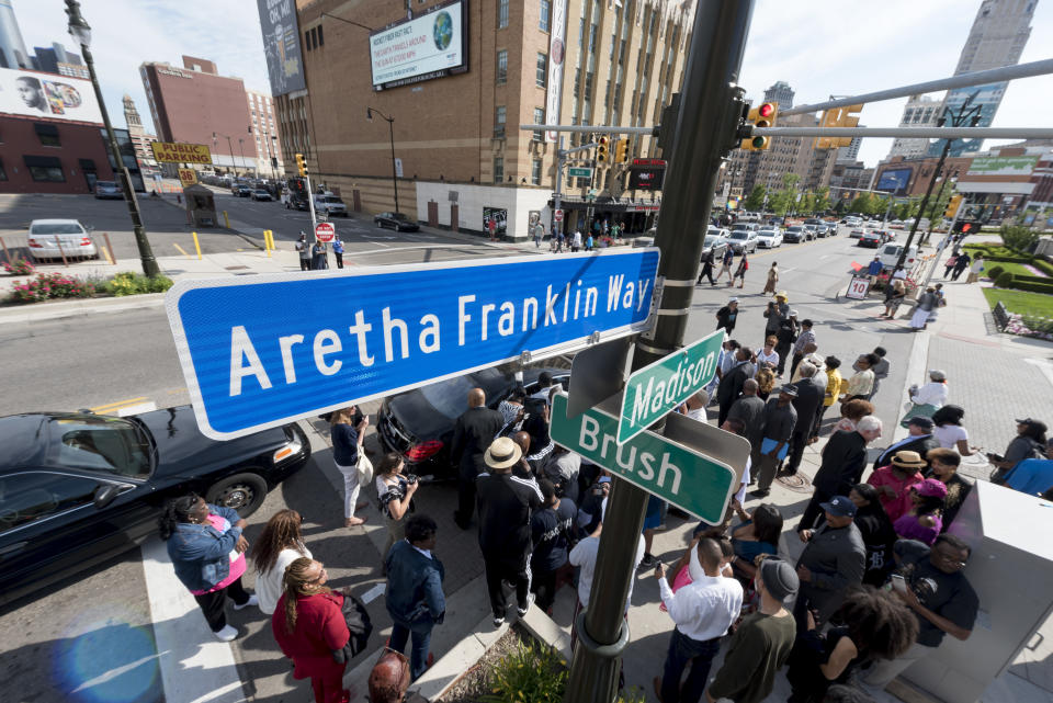 In this Thursday, June 8, 2017 file photo, a street sign for Aretha Franklin Way is unveiled at the corner of Madison and Brush streets, outside of Music Hall in Detroit. (David Guralnick/Detroit News via AP)