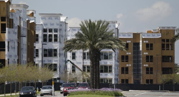 FILE - In this Wednesday, March 25, 2015, file photo, apartment buildings under construction are seen, in Maitland, Fla., a suburb of Orlando. The Commerce Department reports on October U.S. home construction Wednesday, Nov. 18, 2015. (AP Photo/John Raoux, File)