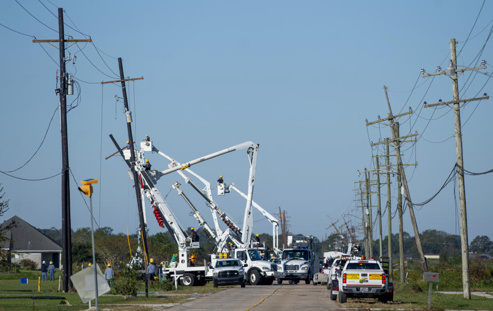 Work crews repair power lines south of Houma, La., following Hurricane Zeta on Thursday, Oct. 29, 2020. Gov. John Bel Edwards says officials are still assessing the extent of Zeta’s damage across the southeastern parishes. (Chris Granger/The Advocate via AP)