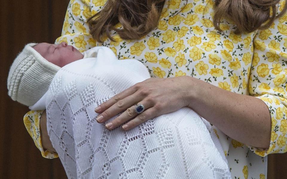 The Duchess of Cambridge wears her sapphire and diamond engagement ring with a wedding band made of Welsh gold - Credit: Rupert Hartley/REX/Shutterstock