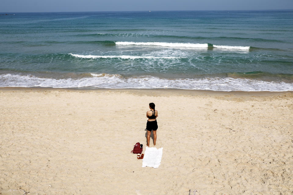 A beachgoer stands still in Tel Aviv.
