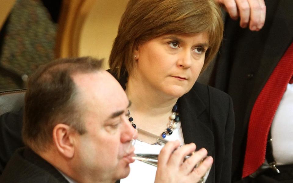 File photo dated 23/02/12 of the then Deputy First Minister Nicola Sturgeon (top) with then First Minister Alex Salmond during First Minister's Questions at the Scottish Parliament in Edinburgh. Former first minister Alex Salmond, giving evidence before the Committee on the Scottish Government Handling of Harassment Complaints , has said there has been 